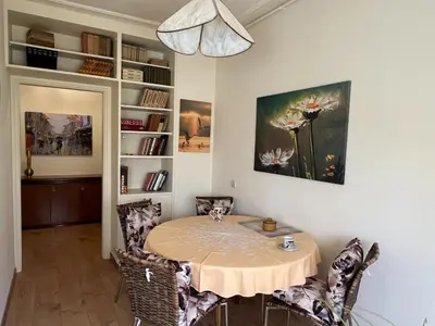 a dining room with a table and some chairs at R&R Apartmant Konjarnik in Belgrade