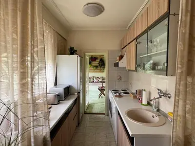 a kitchen with a sink and a refrigerator at R&R Apartmant Konjarnik in Belgrade