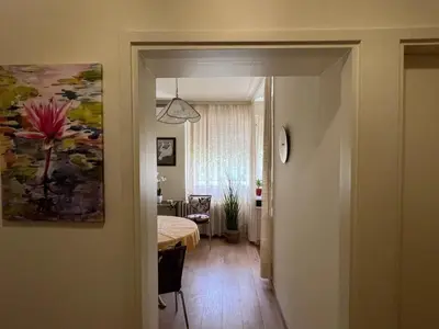 a hallway leading to a room with a bedroom at R&R Apartmant Konjarnik in Belgrade