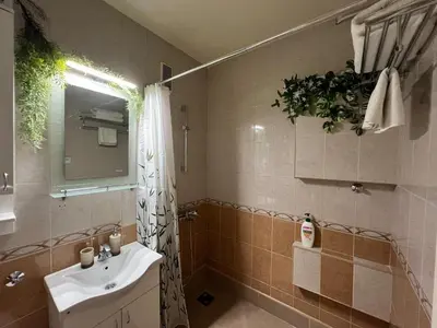 a bathroom with a sink and a mirror at R&R Apartmant Konjarnik in Belgrade