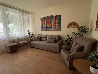 a living room with a couch and a table at R&R Apartmant Konjarnik in Belgrade