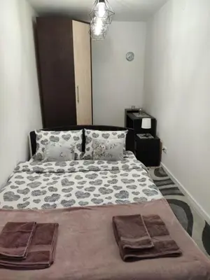 a bed with two towels on it in a bedroom at KS Studio 2 in Belgrade