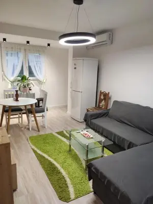 a living room with a couch and a table at KS Studio 2 in Belgrade