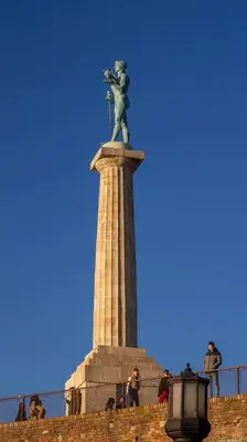 a statue on top of a monument on a wall at Adagio 7 in Belgrade