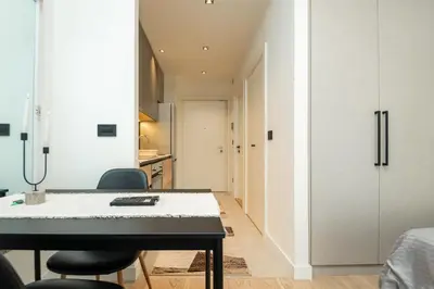 a kitchen and dining room with a table and chairs at BW Simfonija 1 in Belgrade