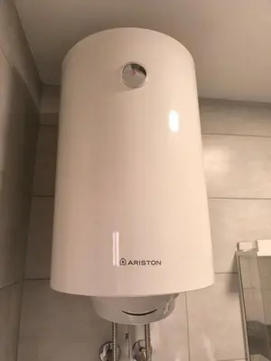 a large white lamp in a bathroom at Apartment for a day, Zemun, Altina, two rooms in Belgrade