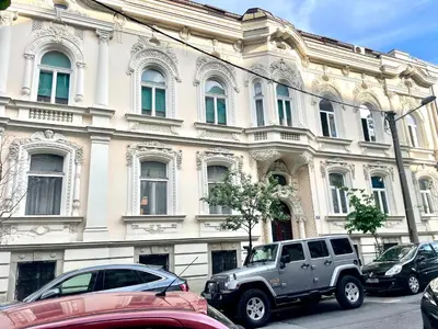 a gray truck parked in front of a building at Perla Suite Vracar in Belgrade