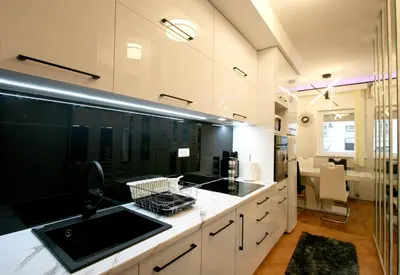 a kitchen with a sink and a counter at Apartment Purple in Belgrade
