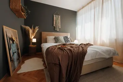a bedroom with a bed with a blanket on it at Bright Harmony with Balcony Old Town Renovated in Belgrade