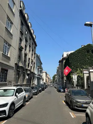 a street with cars parked on the side of the road at Design Suite in Prime Location Superstring Home in Belgrade