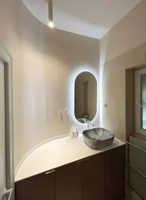 a bathroom with a sink and a mirror at Design Suite in Prime Location Superstring Home in Belgrade