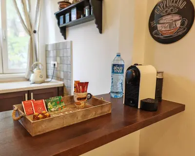 a counter with a tray of food and a bottle of water at The Belfort Townhomes - Lux Salon in Belgrade