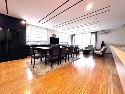 a dining room with a table and chairs at Triplex with garden and parking in Belgrade