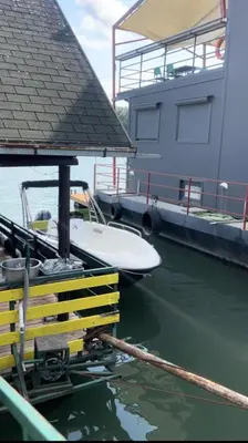 a boat is docked at a dock in the water at Splav na Savi KALIVARIJA in Belgrade