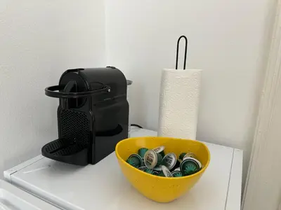 a bowl of money sitting on top of a counter at Eight Apartment in Belgrade