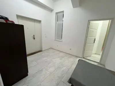 an empty room with a door and a mirror at Nefertiti Apartment in Belgrade