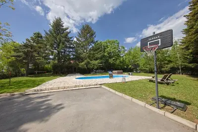 a basketball hoop in a park with a basketball at Avalavanda Cherry Hill in Vlasi