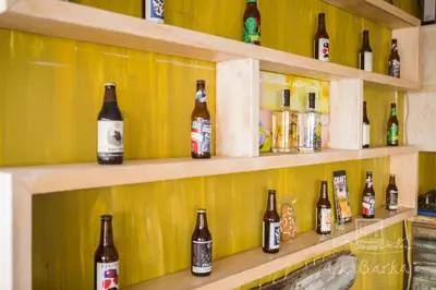 a bunch of bottles sitting on shelves in a store at ArkaBarka 2- Floating Dream Rooms and Apartments in Belgrade