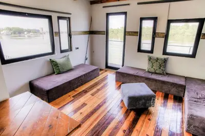 a living room with two couches and windows at ArkaBarka 2- Floating Dream Rooms and Apartments in Belgrade