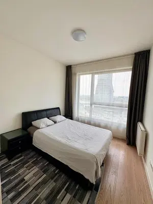 a bedroom with a bed and a large window at BW Aqua Waterside Sandy in Belgrade