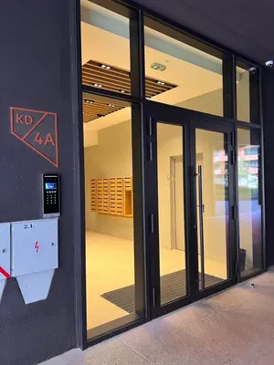 an entrance to a building with sliding glass doors at K-District Apartment Charlie in Belgrade