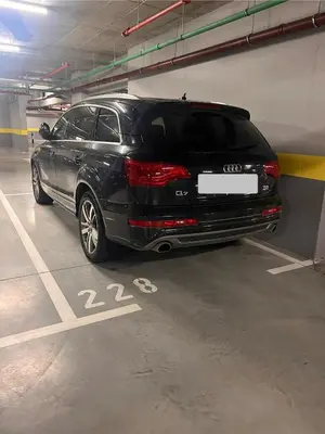 a black audi car parked in a parking garage at K-District Apartment Charlie in Belgrade