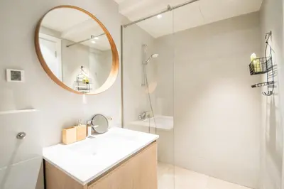 a bathroom with a sink and a mirror at New York Belgrade Waterfront in Belgrade
