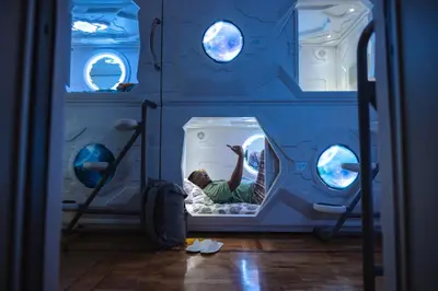 a child in a fish tank in a room at Belgrade Beocean Capsule Hostel in Belgrade