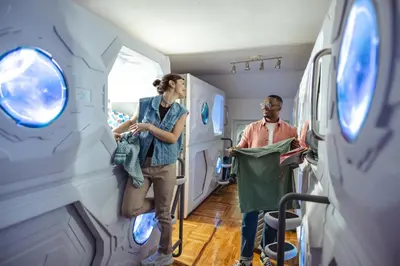 a man and a woman standing in a hospital room at Belgrade Beocean Capsule Hostel in Belgrade