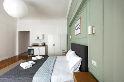 a bedroom with a bed with two pillows on it at High Note Suites in Belgrade