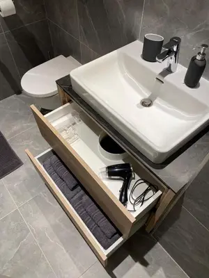 a bathroom with a sink and a counter with towels at Belgrade Waterfont, Symphony 1, Studio 307 in Belgrade