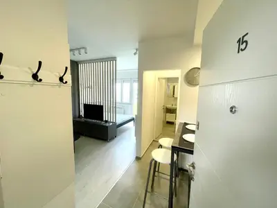 a room with a kitchen and a living room at Apartment LUX 15 Historical Center Belgrade in Belgrade