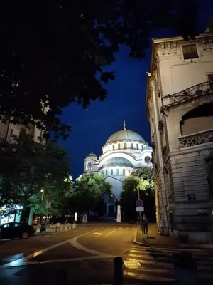 a large white building with a domed roof at night at Apartment LUX 15 Historical Center Belgrade in Belgrade