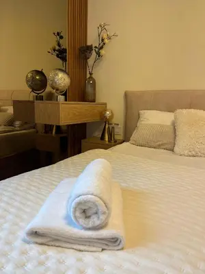 a bedroom with a bed with a towel on it at Belgrade Waterfront Dream in Belgrade