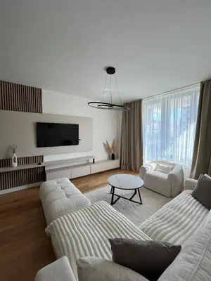 a living room with two couches and a tv at Belgrade Waterfront Dream in Belgrade