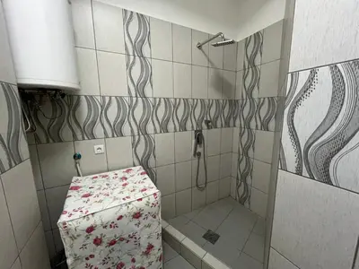 a small bathroom with a shower with a box in it at Pablo MovieSTAR in Belgrade