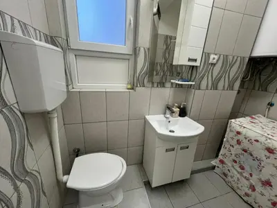 a small bathroom with a toilet and a sink at Pablo MovieSTAR in Belgrade