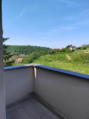 a balcony with a view of a hill at Lux Apartman Banjica in Bukorovac