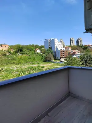 a balcony with a view of a city at Lux Apartman Banjica in Bukorovac