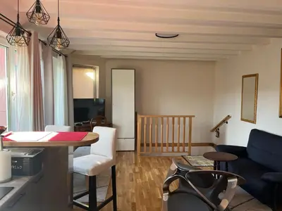 a living room with a couch and a table at ZeMoon Apartment in Belgrade
