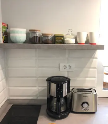 a coffee maker sitting on a counter in a kitchen at ZeMoon Apartment in Belgrade