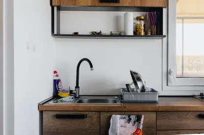 a kitchen counter with a sink and a mirror at Splav na Savi - House on the river in Ostrvo Sprud