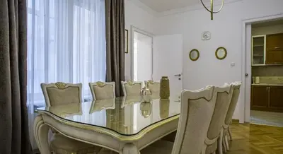 a dining room with a glass table and chairs at Apartment in city center of Belgrade in Belgrade