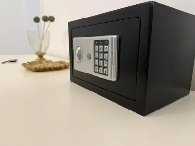 a microwave oven on a table with a vase at Apartment in city center of Belgrade in Belgrade