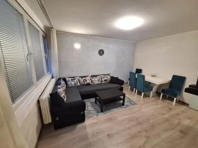 a living room with a couch and a table at Stan na dan Banovo brdo in Belgrade