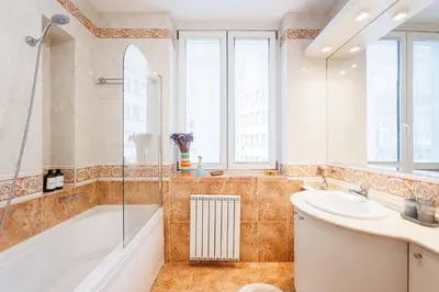 a bathroom with a tub and a sink and a shower at Colored Happiness 115m2 with Balcony Old Town in Belgrade