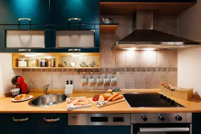a kitchen with a sink and a bowl of fruit at Colored Happiness 115m2 with Balcony Old Town in Belgrade
