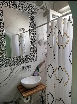 a bathroom with a sink and a mirror at on top of the city in Belgrade