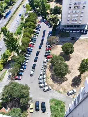 an aerial view of a parking lot with cars parked at on top of the city in Belgrade
