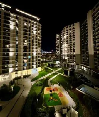 a view of a city at night with tall buildings at BW Simfonia Apartman 407-whit free garage parking in Belgrade